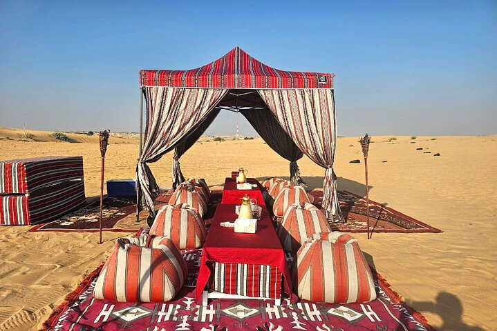 Experience the serenity of the desert surrounded by plush seating aromatic delights and the inviting glow of candlelight perfect for a memorable evening under the stars with loved ones.